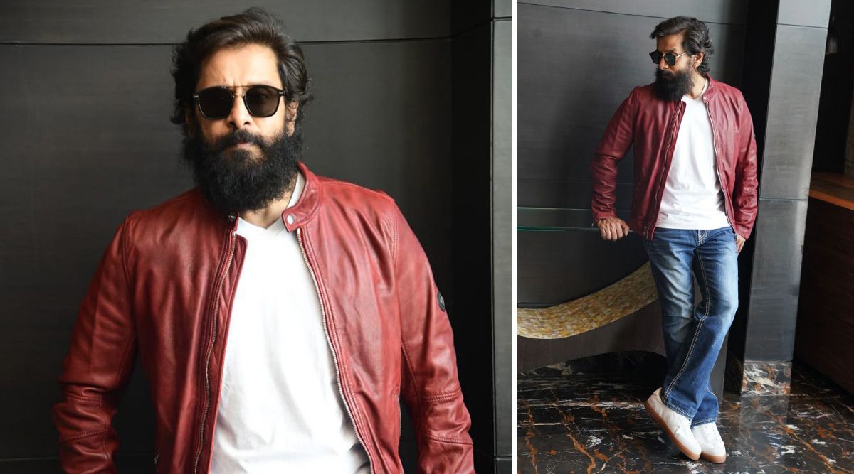 Chiyaan Vikram sports a stylish charcoal jacket for Cobra promotions in Hyderabad