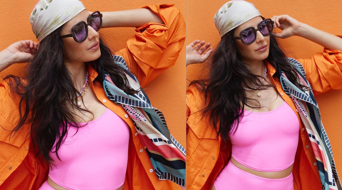 Katrina Kaif wears an orange shirt with her Balenciaga swimwear, giving us a bohemian mood on the beach