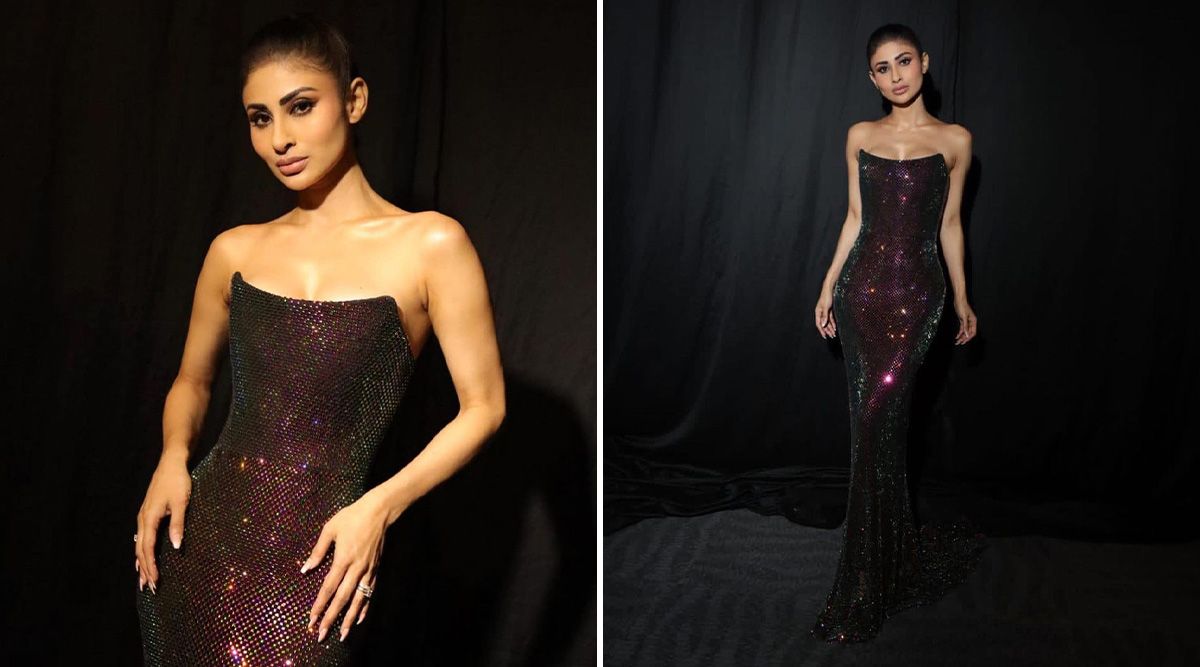 Mouni Roy's body-hugging Maroon sequin metallic gown gives a sassy look with minimal makeup. Read more!