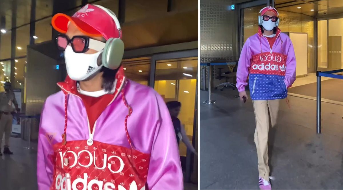 Ranveer Singh poses for a photo at the airport while wearing a $25,000 pink and blue acetate jacket