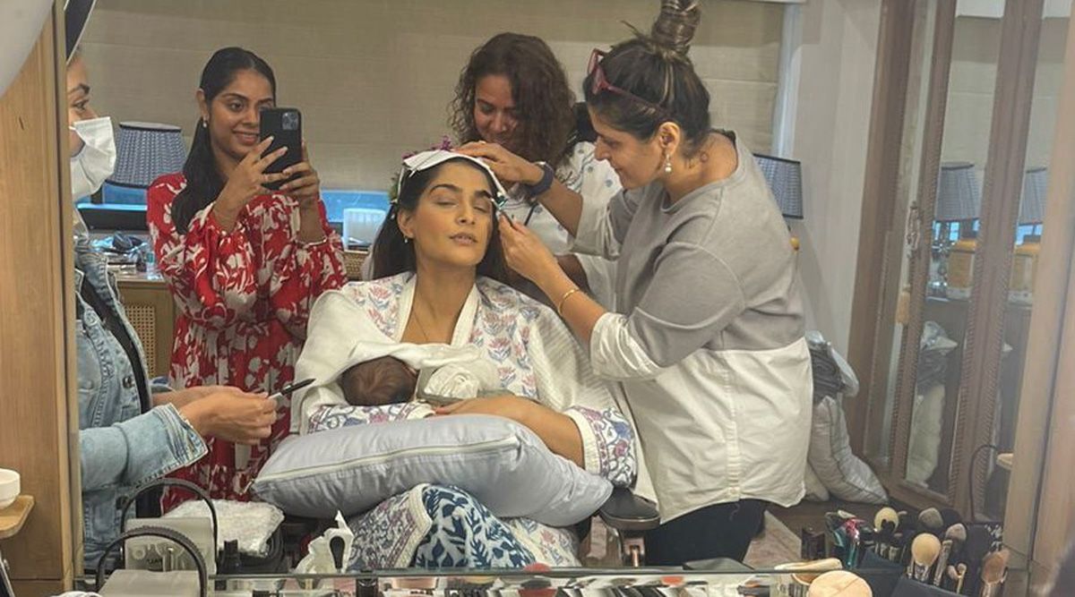 Sonam Kapoor is seen nursing baby Vayu while getting ready in the video, and Anand Ahuja's reaction is priceless