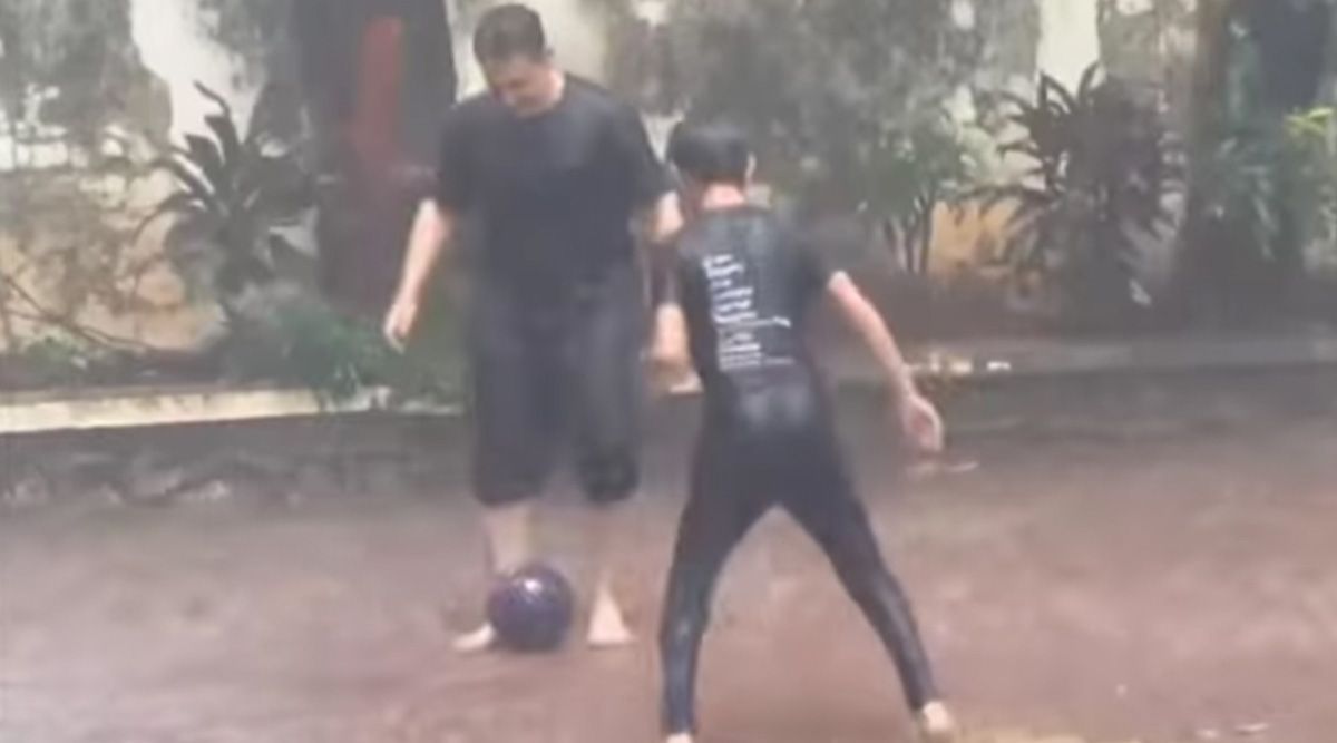 Aamir Khan plays football with his son Azad Rao in heavy Mumbai rains