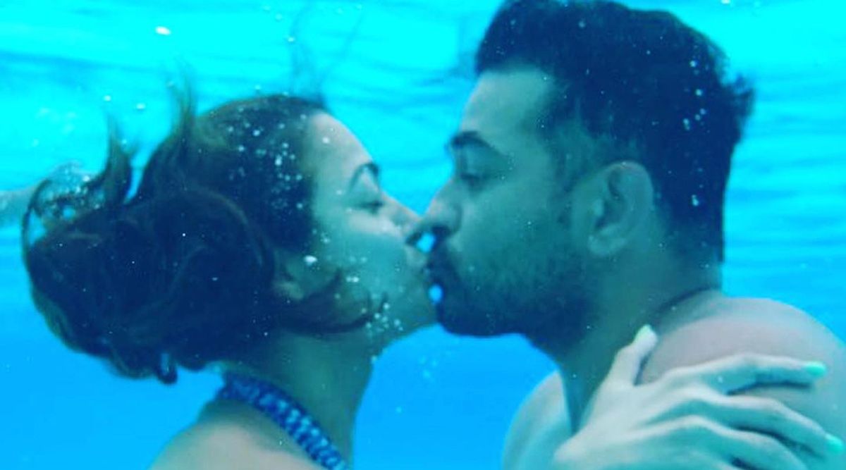 Amrita Arora shares a romantic underwater kiss with husband on the occasion of Valentine's Day