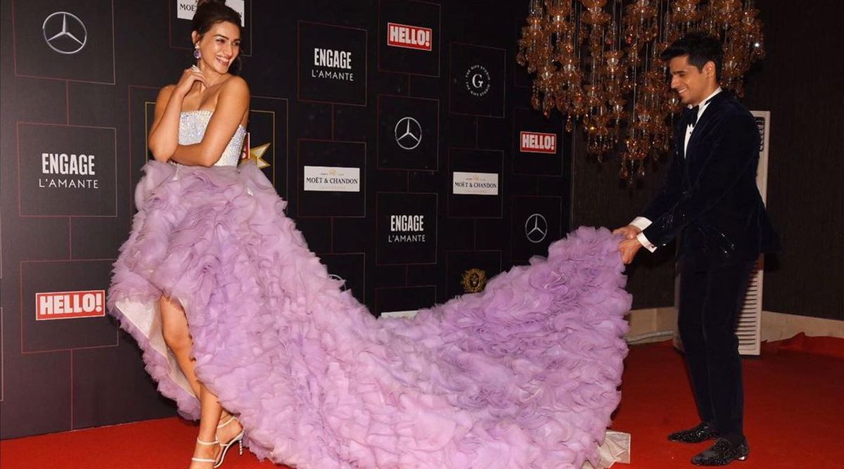 At the Hello Awards red carpet, Sidharth Malhotra displays chivalry as he was seen holding the train of Kriti Sanon's gown