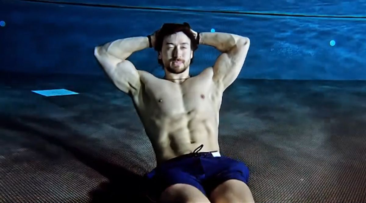 The temp rises as Tiger Shroff strips off his shirt to reveal his abs underwater; TAKE A LOOK